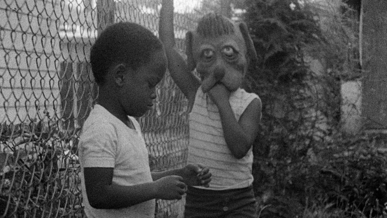 two children by a fence
